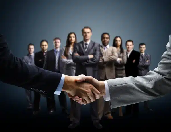 depositphotos_7122650-stock-photo-handshake-isolated-on-business-background